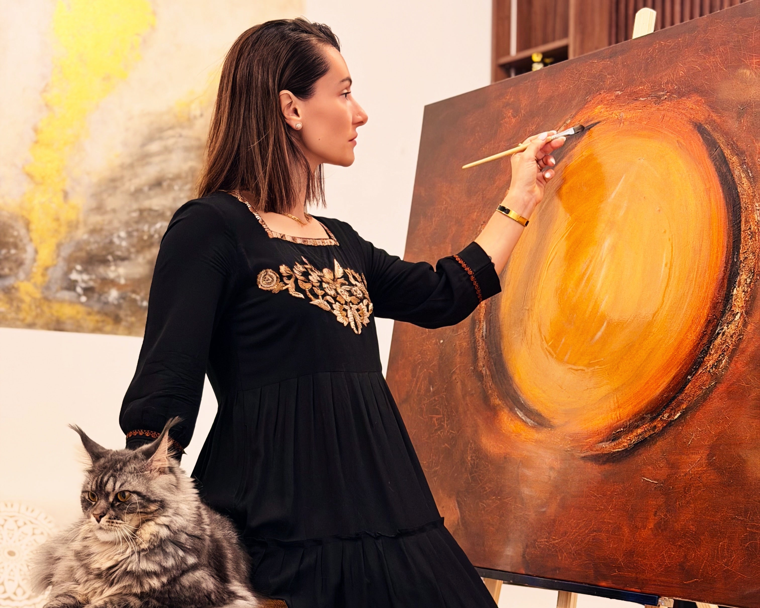 Cristina Gabriela Buzatu at work in her studio, creating contemporary paintings and installations that explore silence, truth, and the human condition.