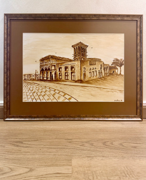 Coffee painting on paper by Cristina Gabriela Buzatu depicting traditional Emirati architecture with a historic wind tower, framed with matte anti-glare museum glass.
